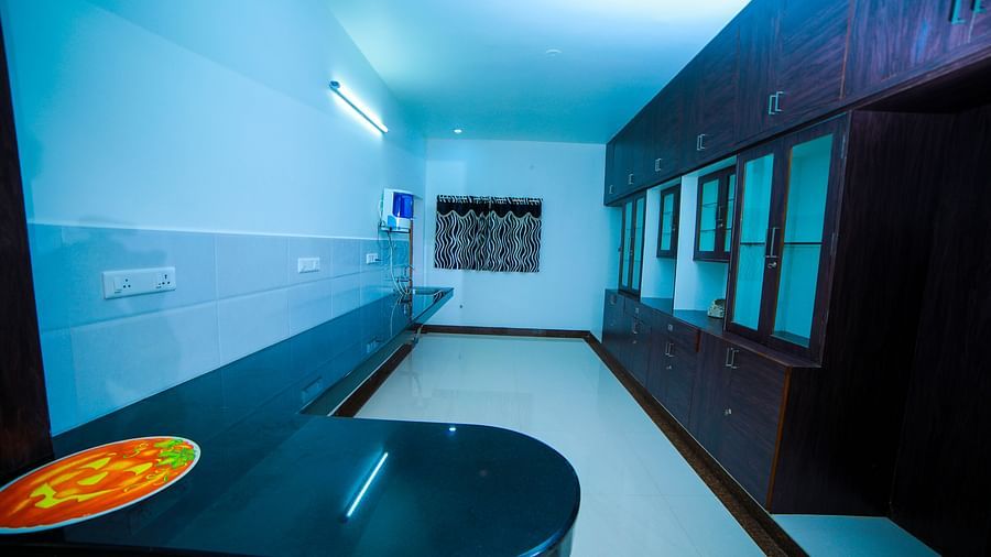 Image of a room with an electric water filter and shelves on the side at WOW Bison Woods.